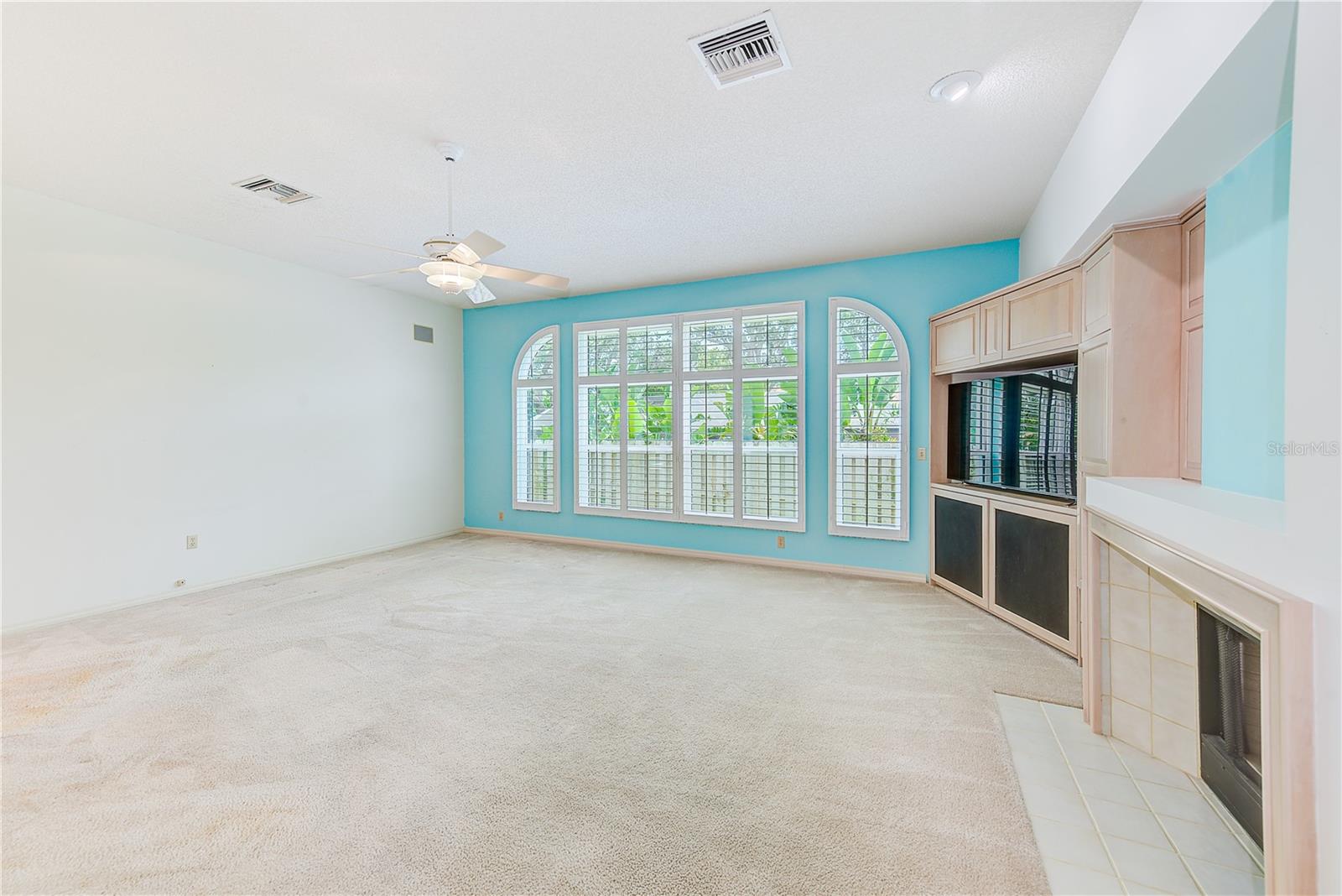 Family room with shutters and hurricane rated windows
