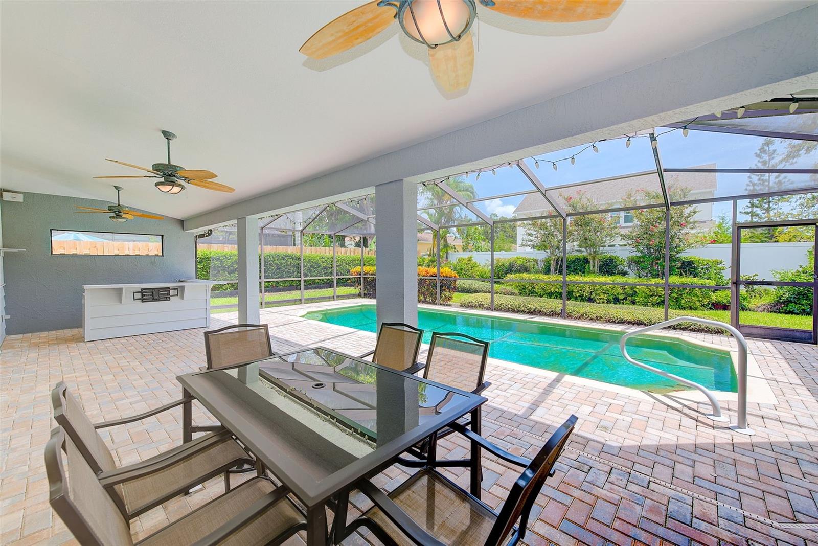 Beautiful pavered lanai and pool area