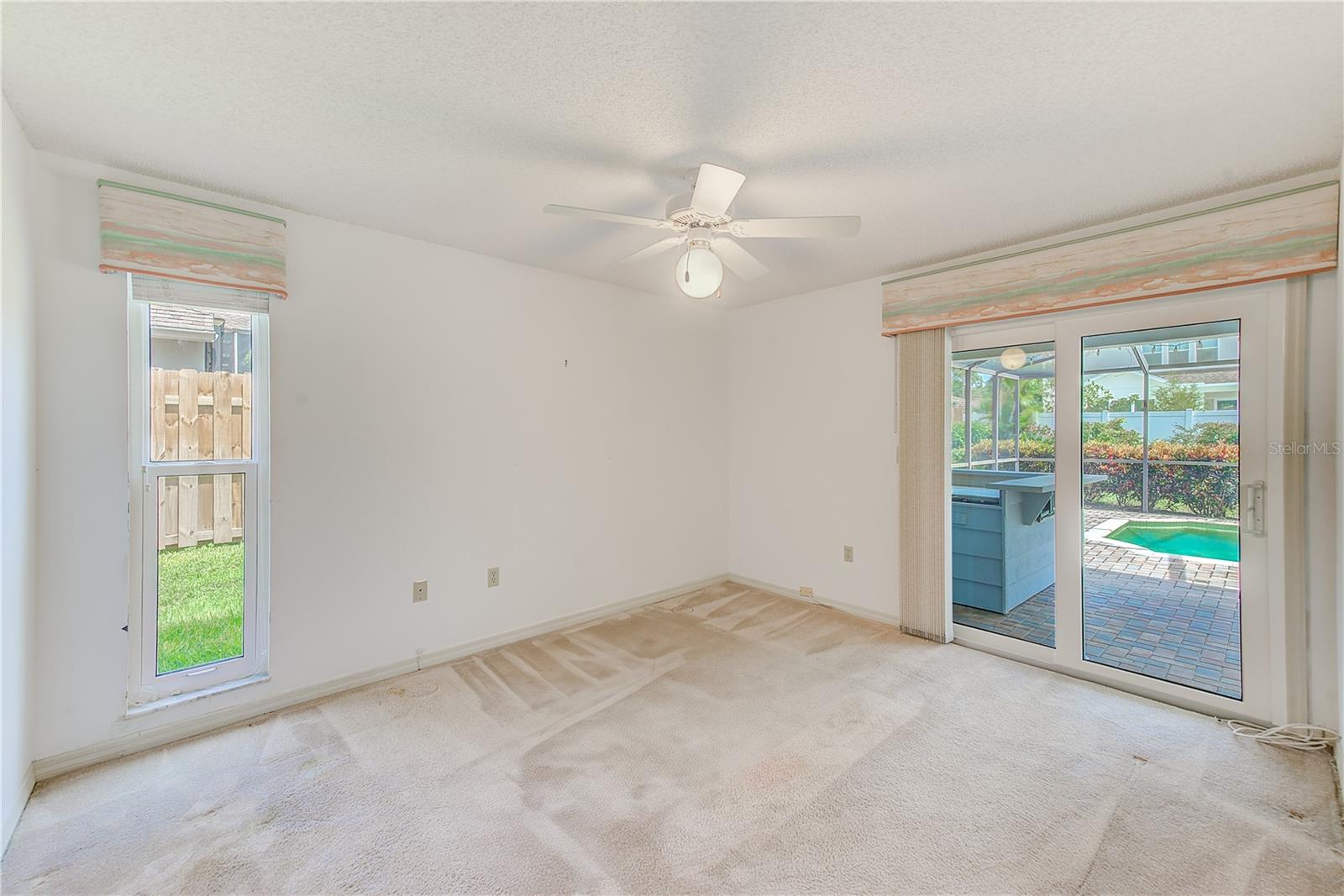 Bedroom 2 with access to the pool area