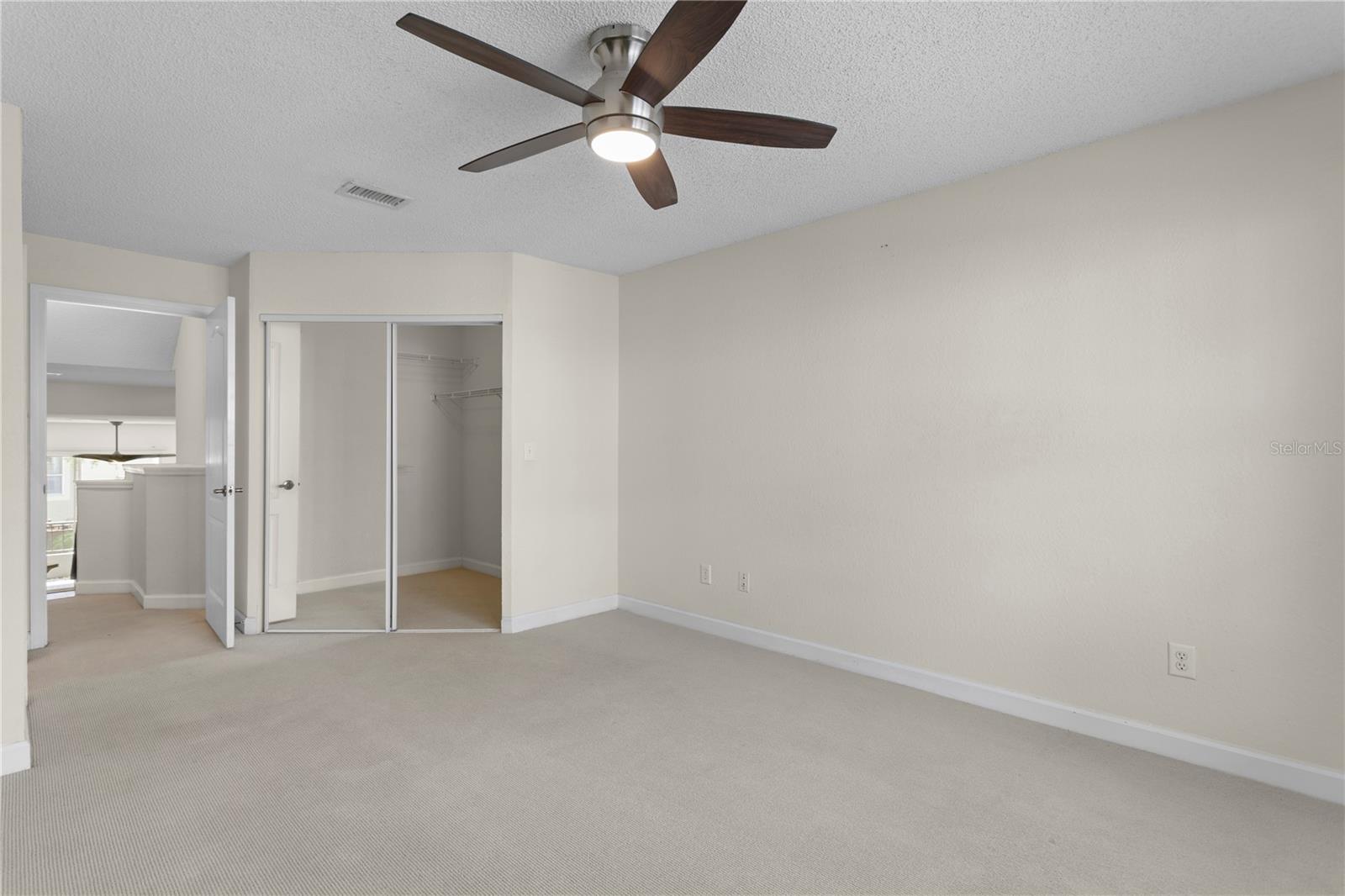 Relax and recharge in the generously sized primary bedroom.
