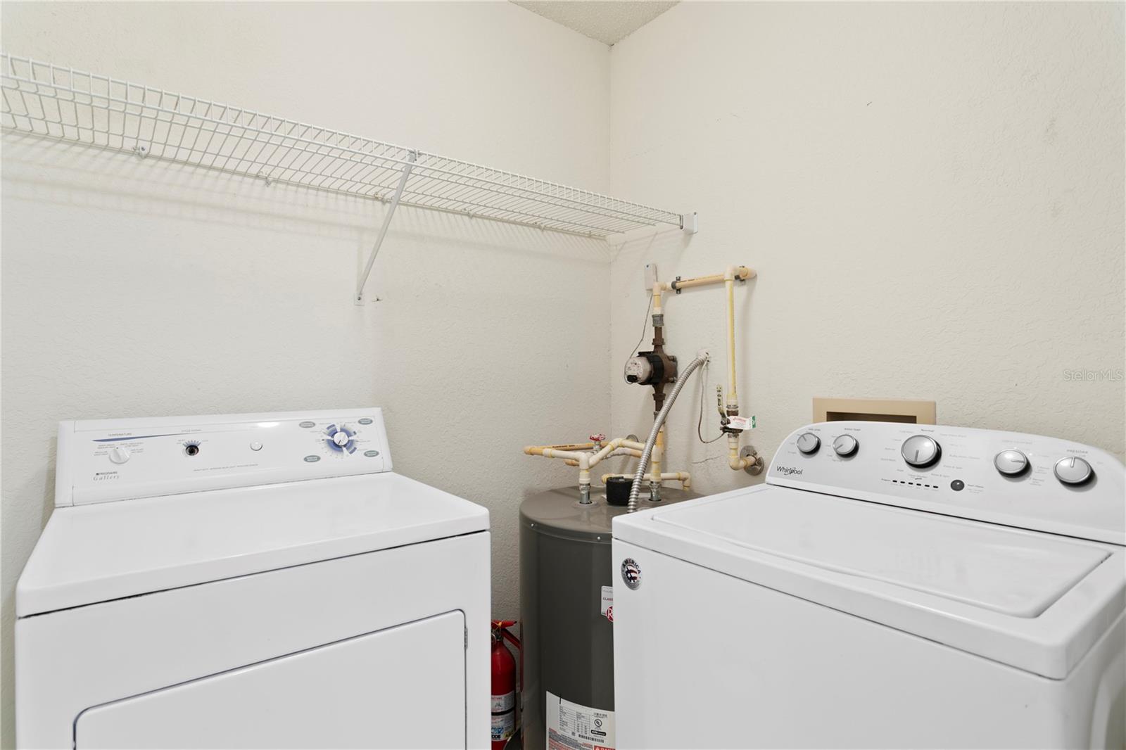 The laundry room conveniently located right by the bedroom makes chores effortless.
