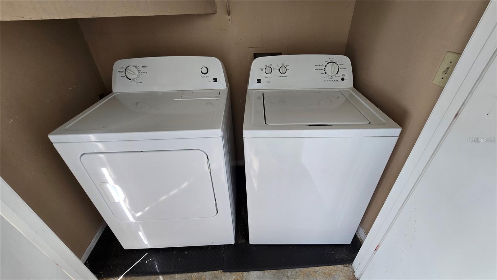 washer and dryer on porch overlooking the river