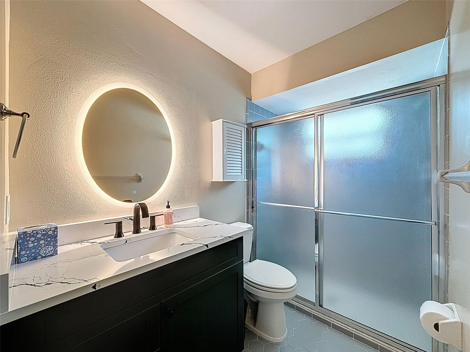 SECOND bedroom's en-suite bathroom with closet.