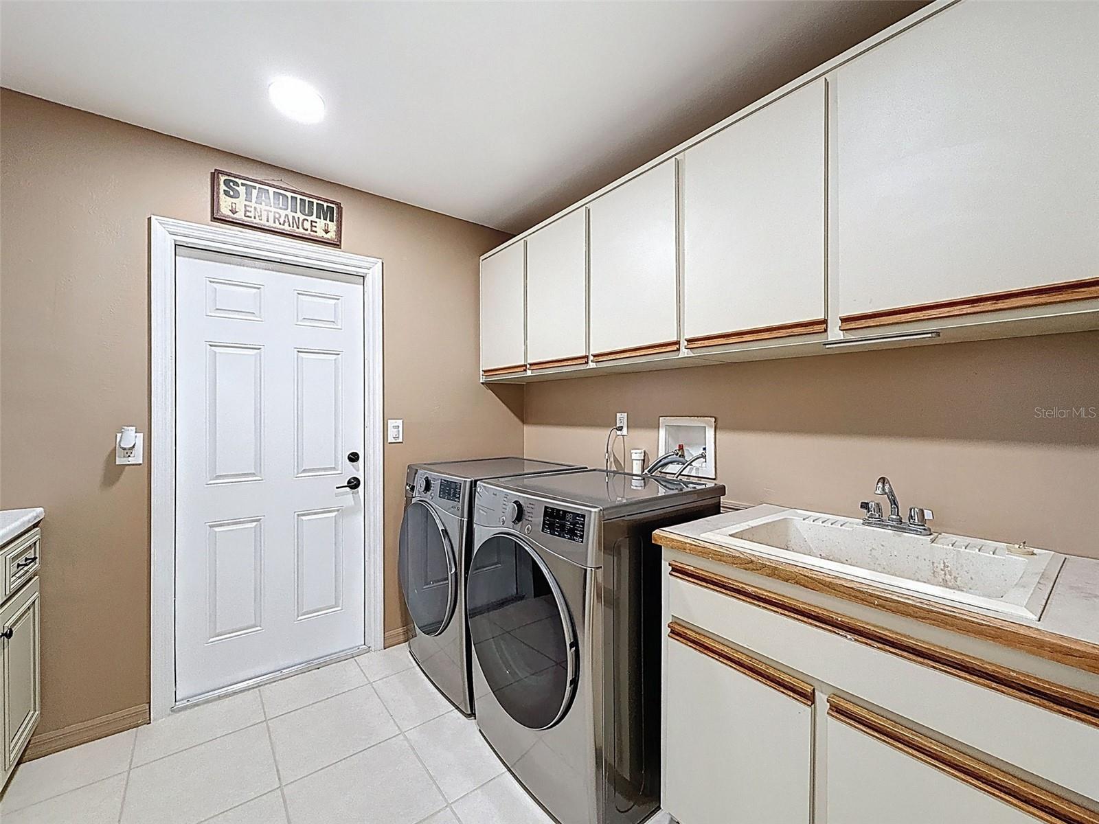 Laundry room leading to garage