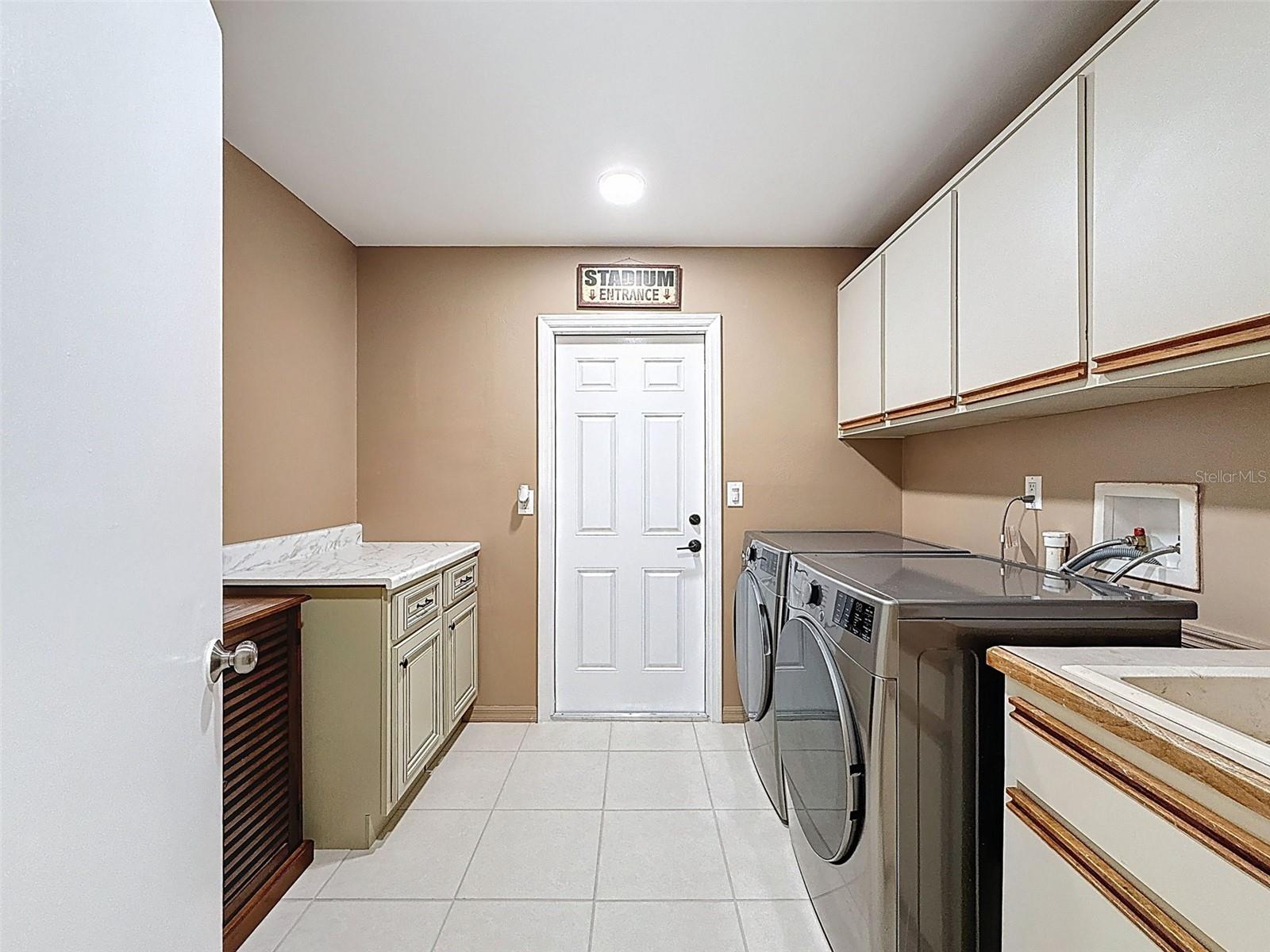 Laundry room leading to garage