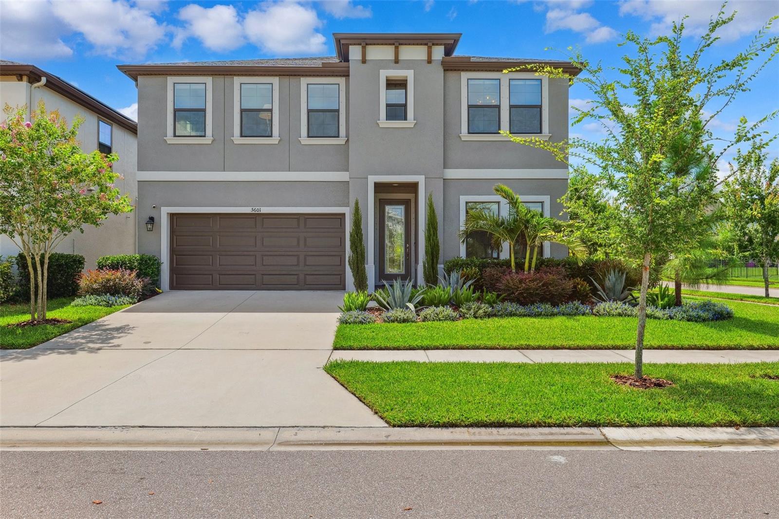 Welcome Home! Notice the fresh exterior paint and beautiful, low maintenance landscaping!