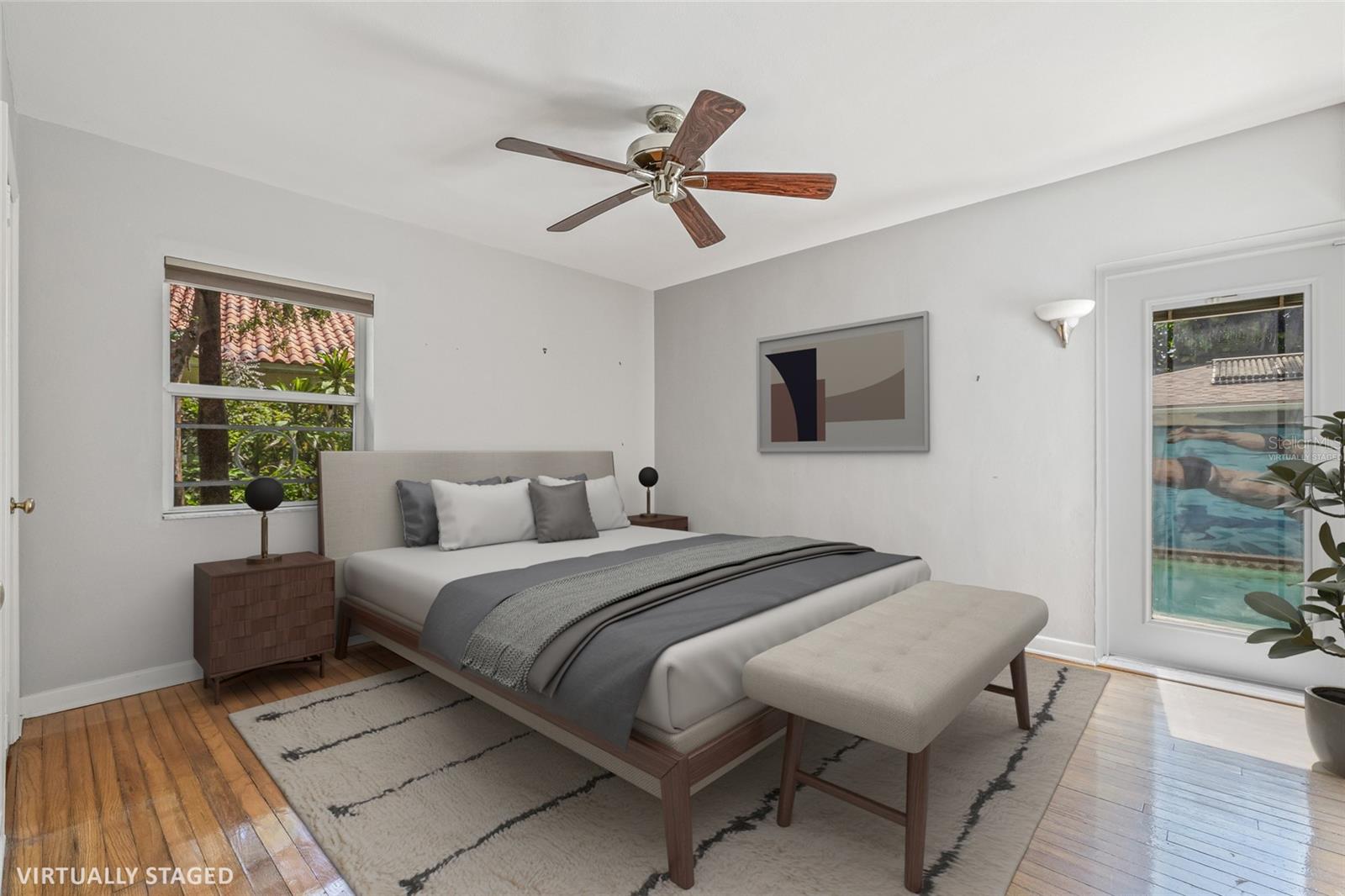 Virtually Staged. Rear bedroom with its own en-suite bathroom and views of the pool.