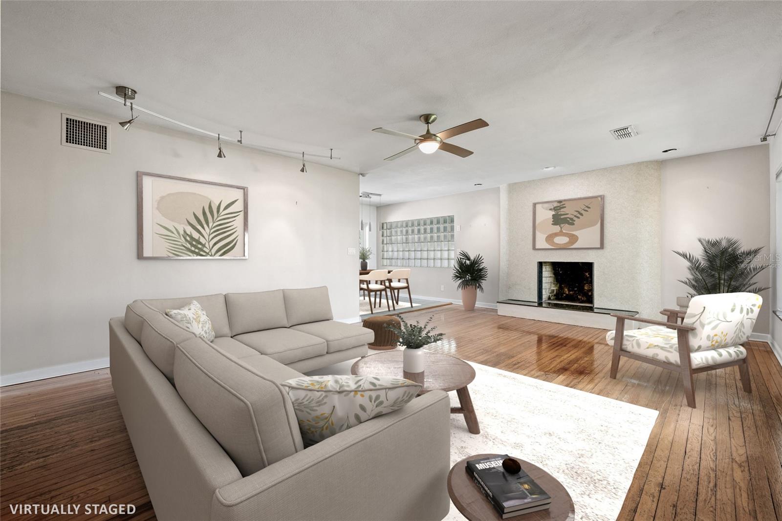 Virtually Staged. Large living room with chic hearth provides excellent space for entertaining, music, dining and desk space.