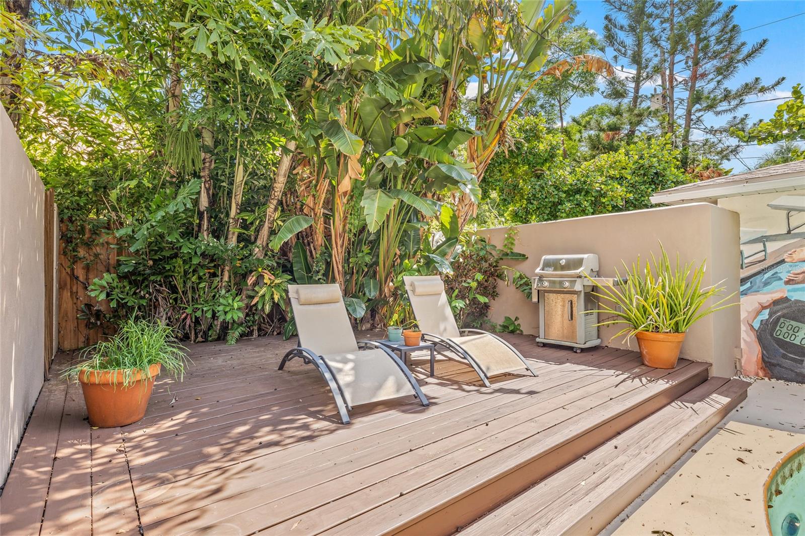 Second deck/lounge space by the pool.