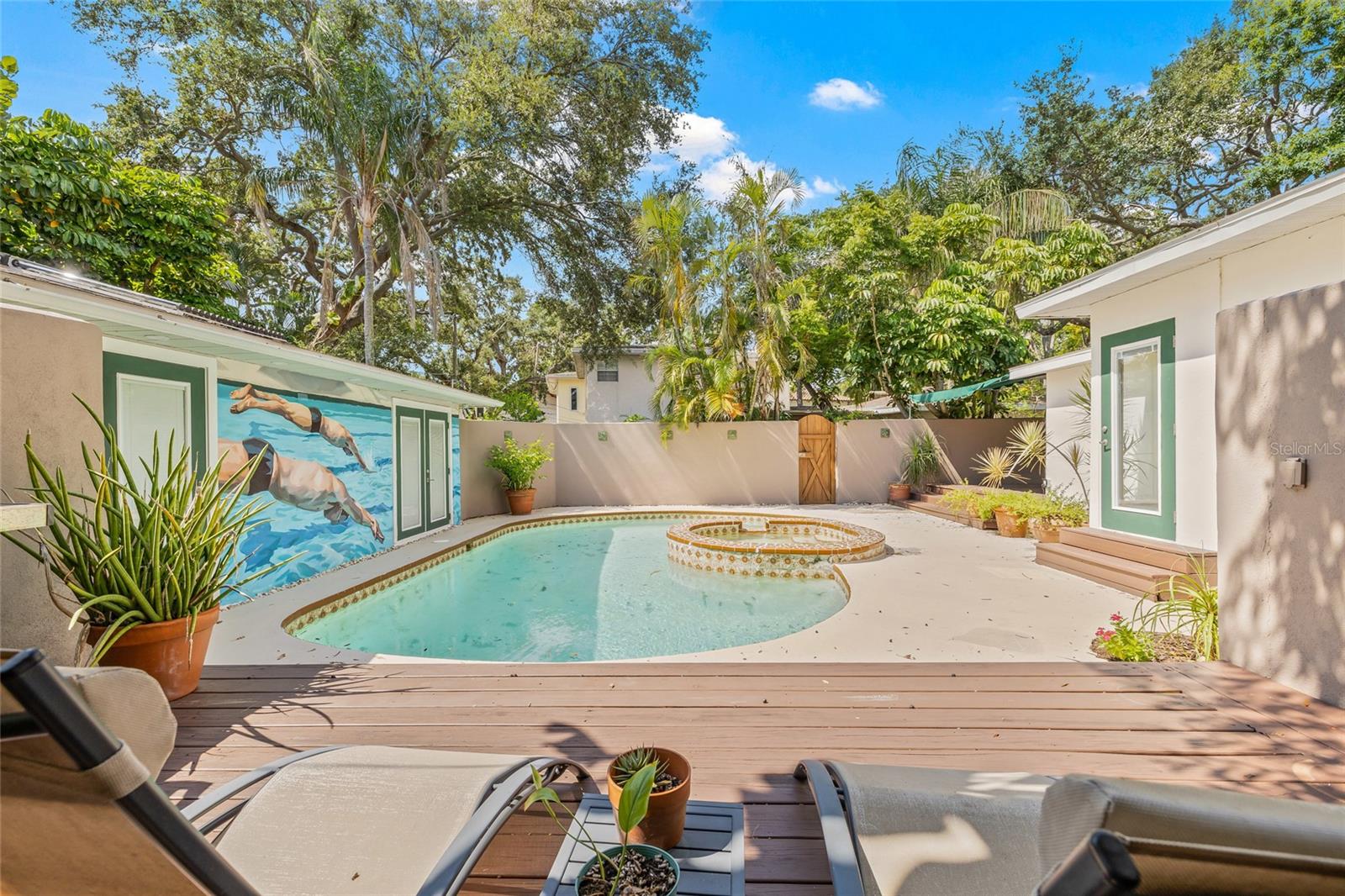 Your private courtyard awaits with the main dwelling to the right and guesthouse to the left.