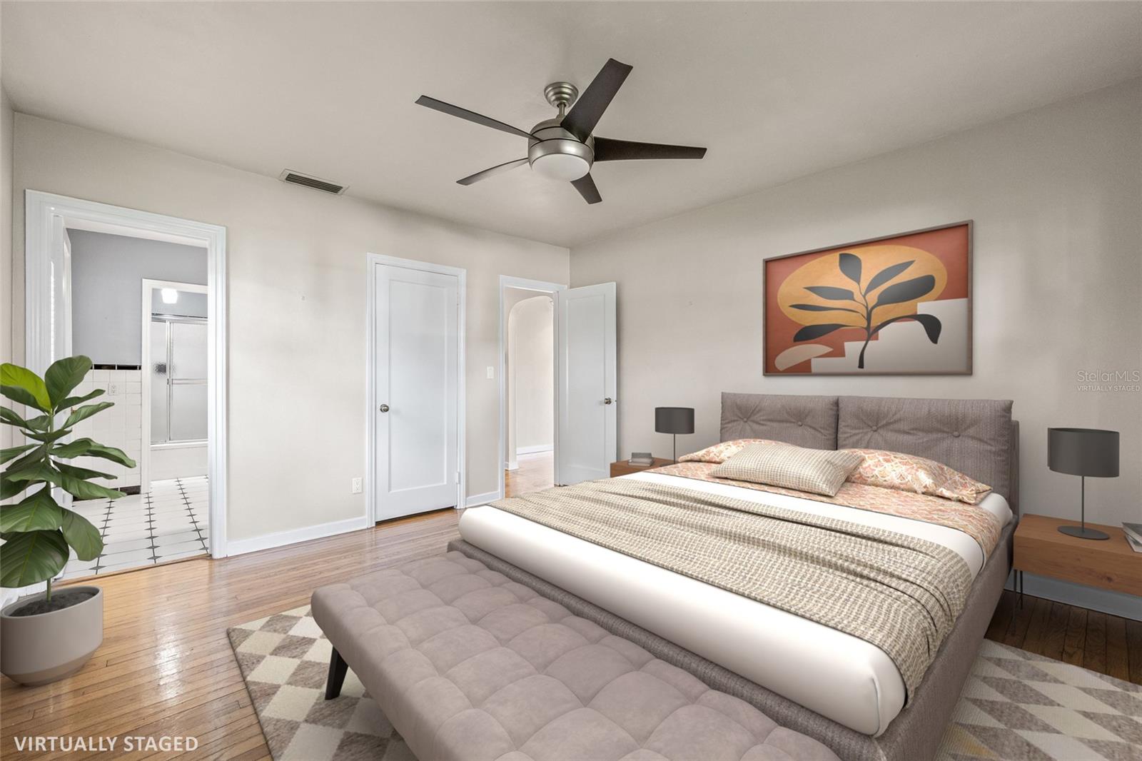 Virtually Staged. Front bedroom with hardwood floors and en-suite bathroom.