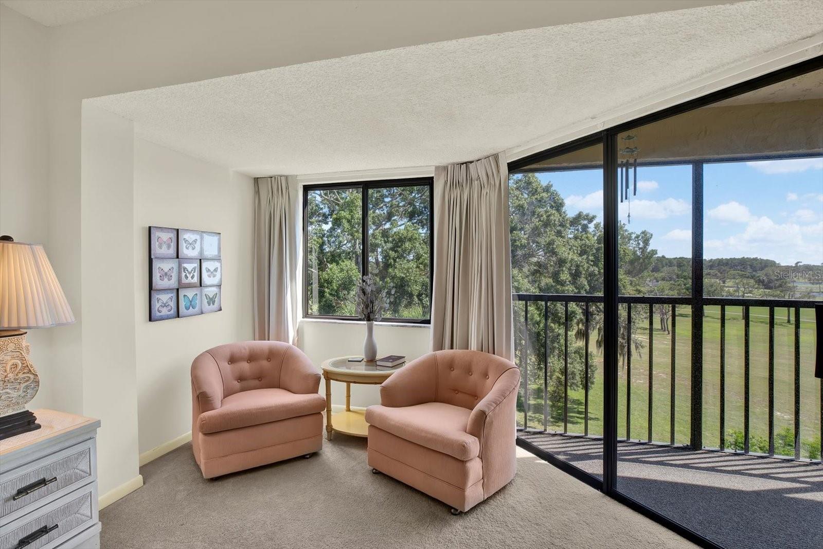 Master Bedroom Sitting Area – View & Patio Access.