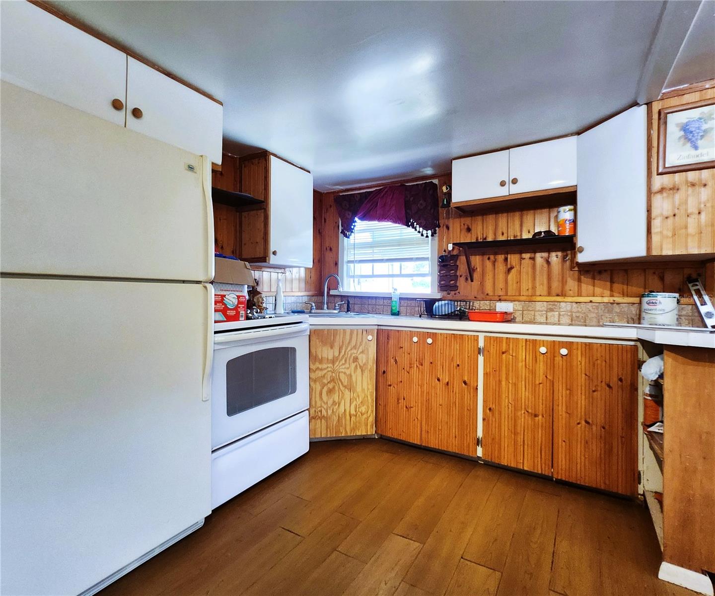 Working and clean appliances: refrigerator, electric stove
