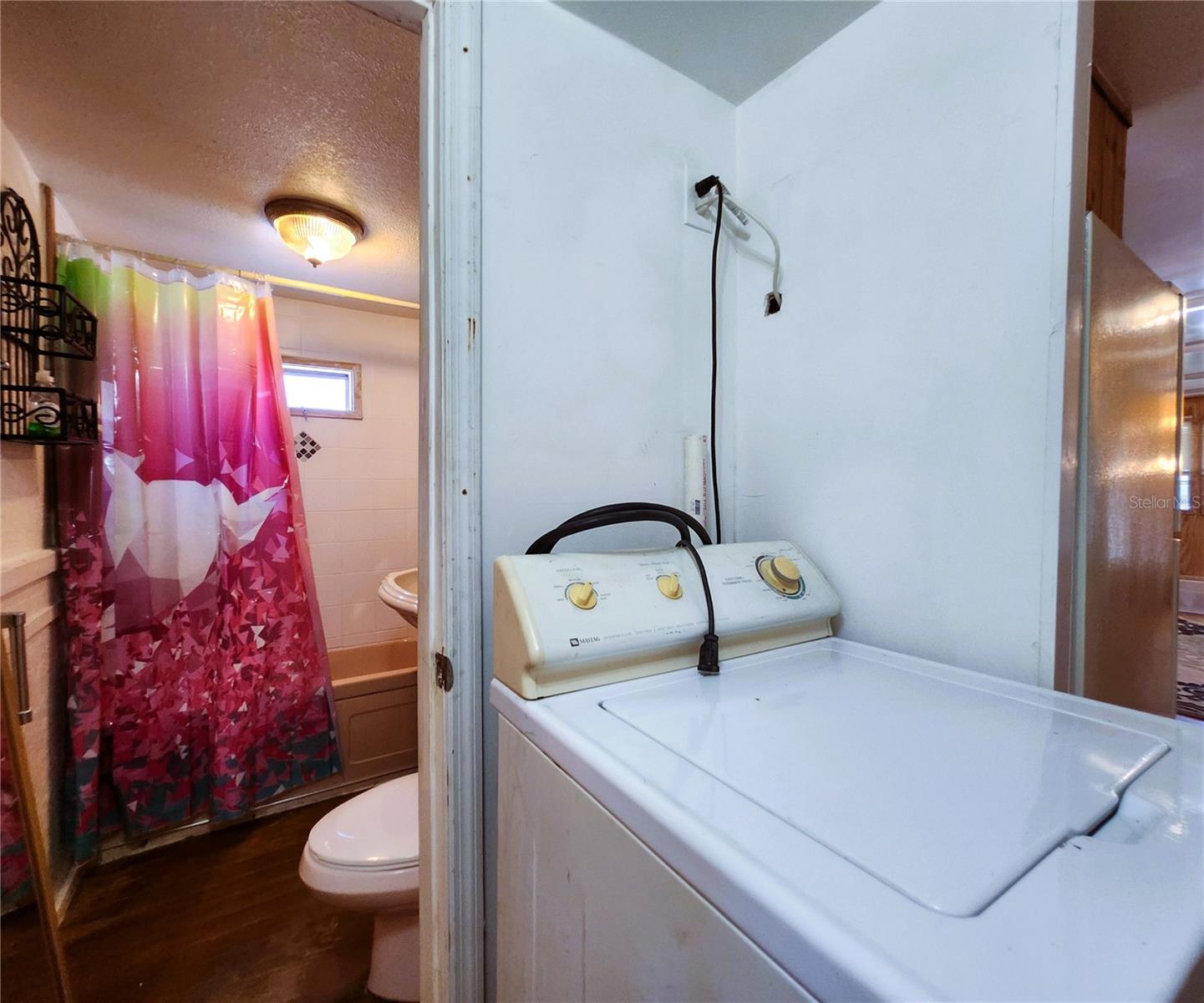 Interior Laundry area includes a full sized washer