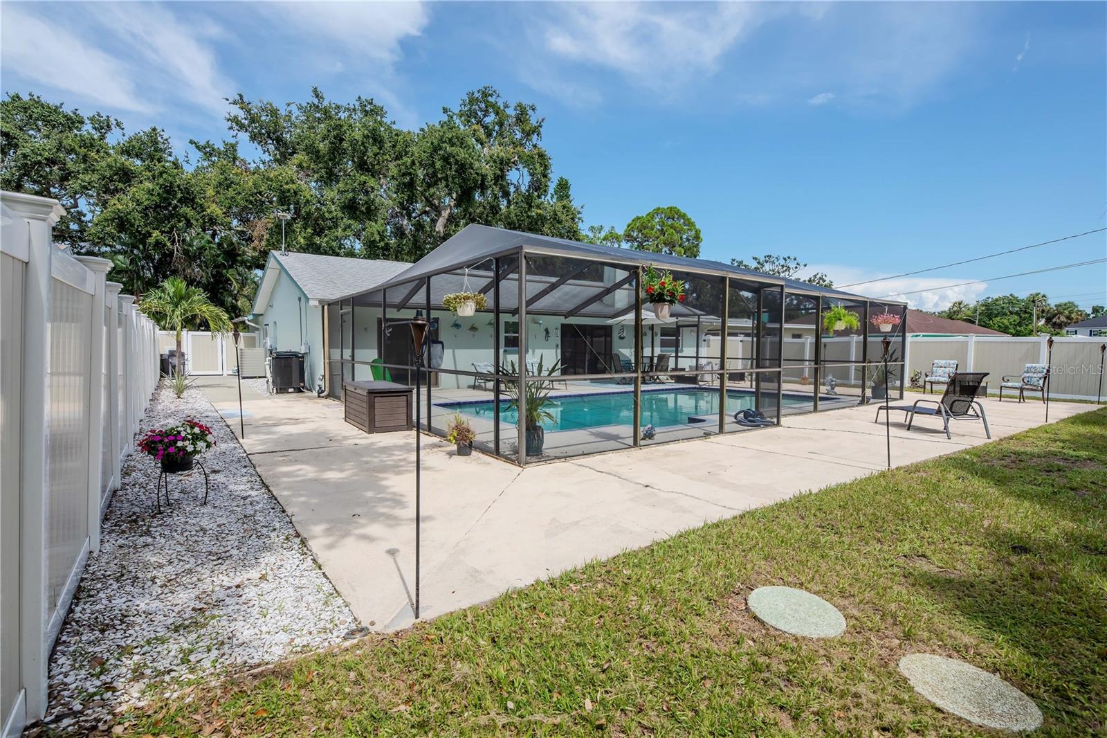 Paved Walkway around pool and large yard