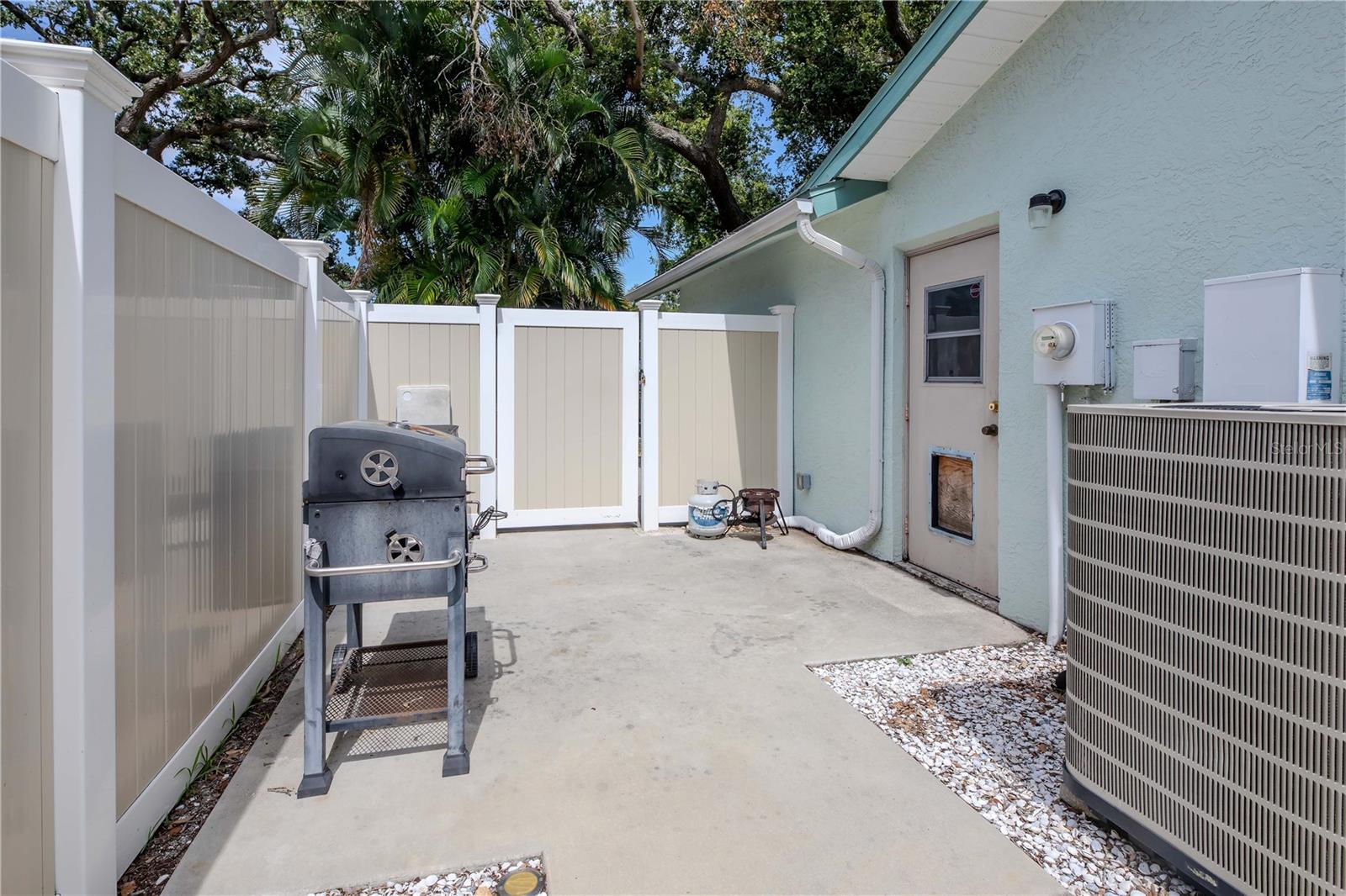 Side garage door and paved walkway