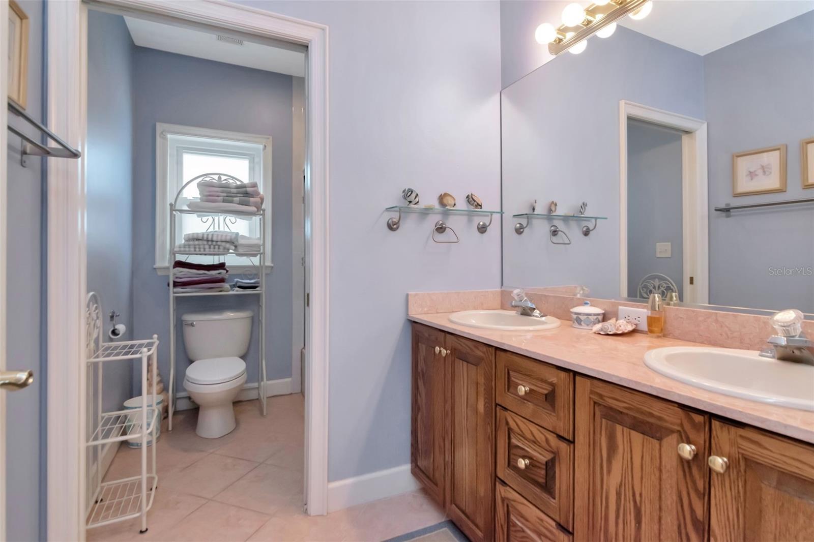 Bedrooms 1 & 2 share a hall bath with double sinks.