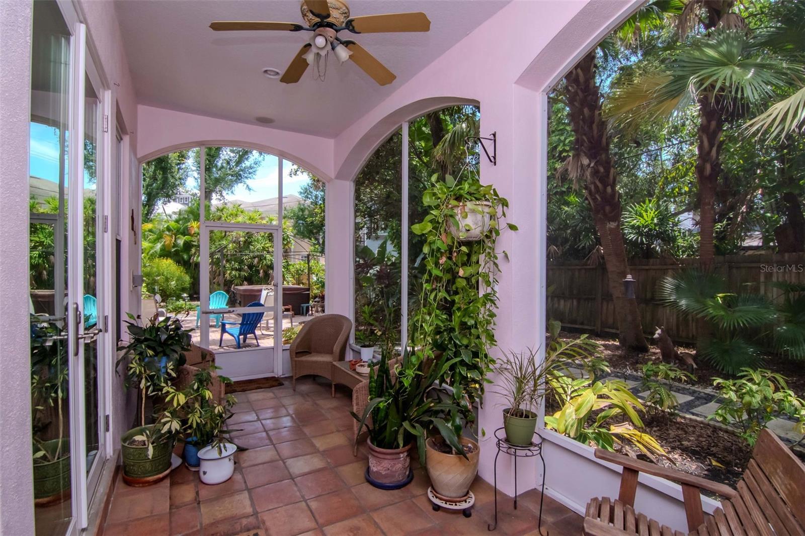 Screened rear porch connects family room and palatial rear yard.