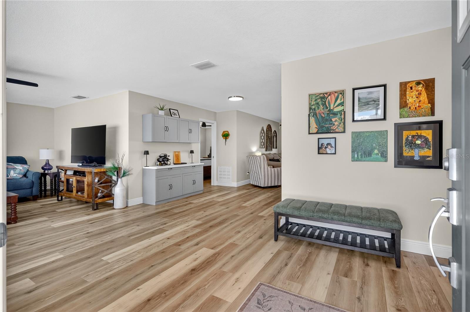 Open concept foyer and living room and dining area.