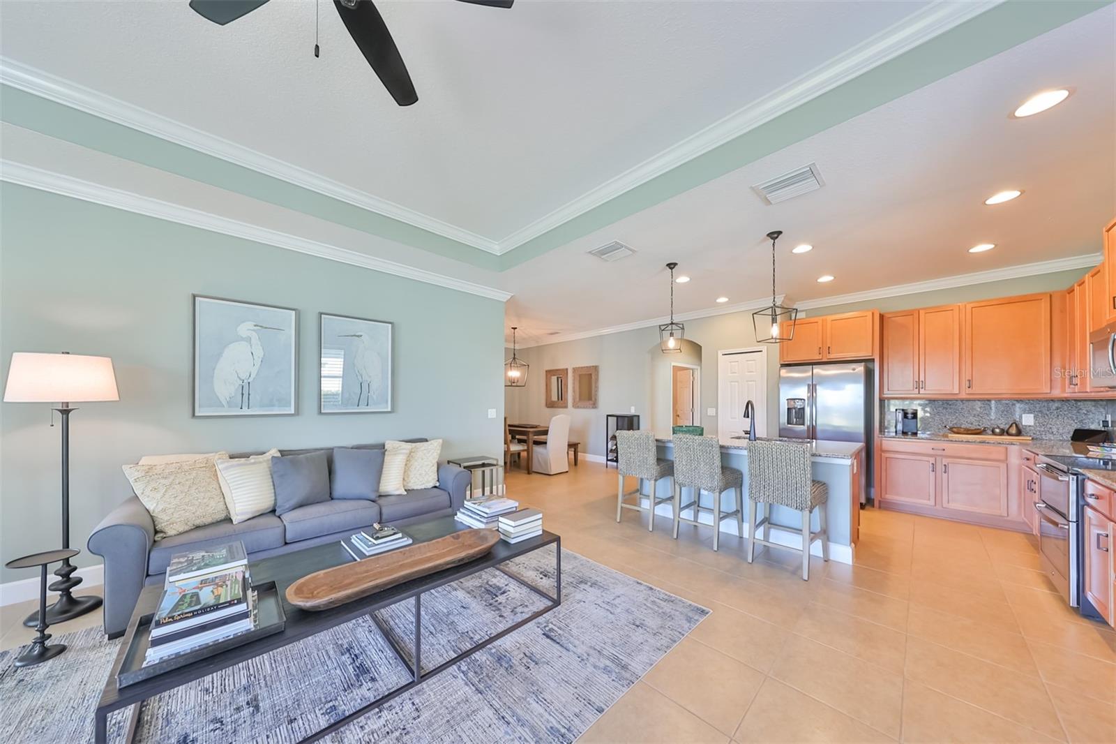 Attention to detail was definitely kept in mind when designing this home. The crown molding offers a classy touch of elegance, along with the trey ceilings.  Notice how bright this unit is..