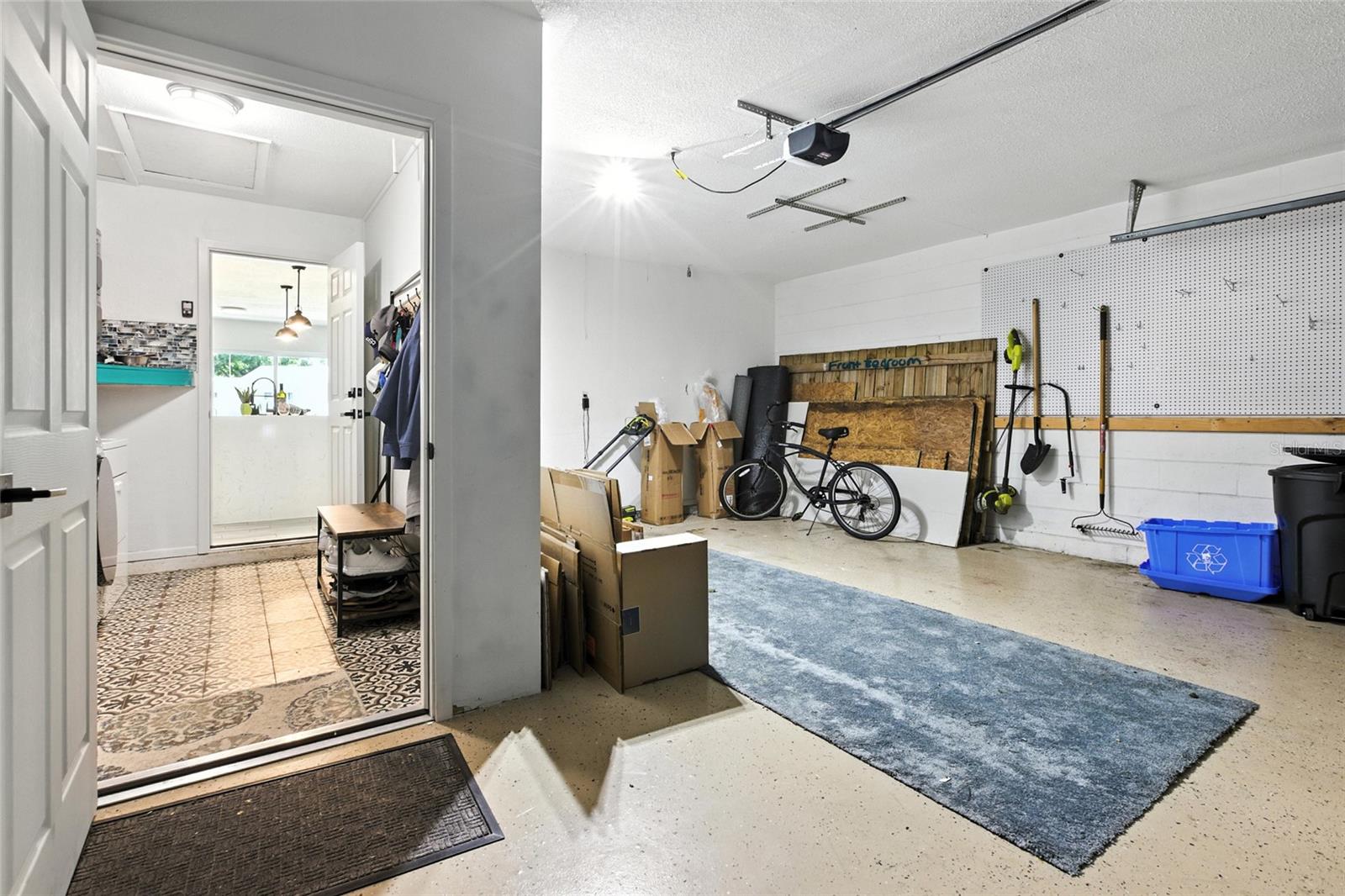 Converted to a 1-bay garage to create a dedicated indoor laundry room—a rare and valuable upgrade in Florida. Still offers plenty of space for storage or a workshop setup and parking for a car! also has a 220V outlet waiting for an EV Charger (Level 2 charging compatible)