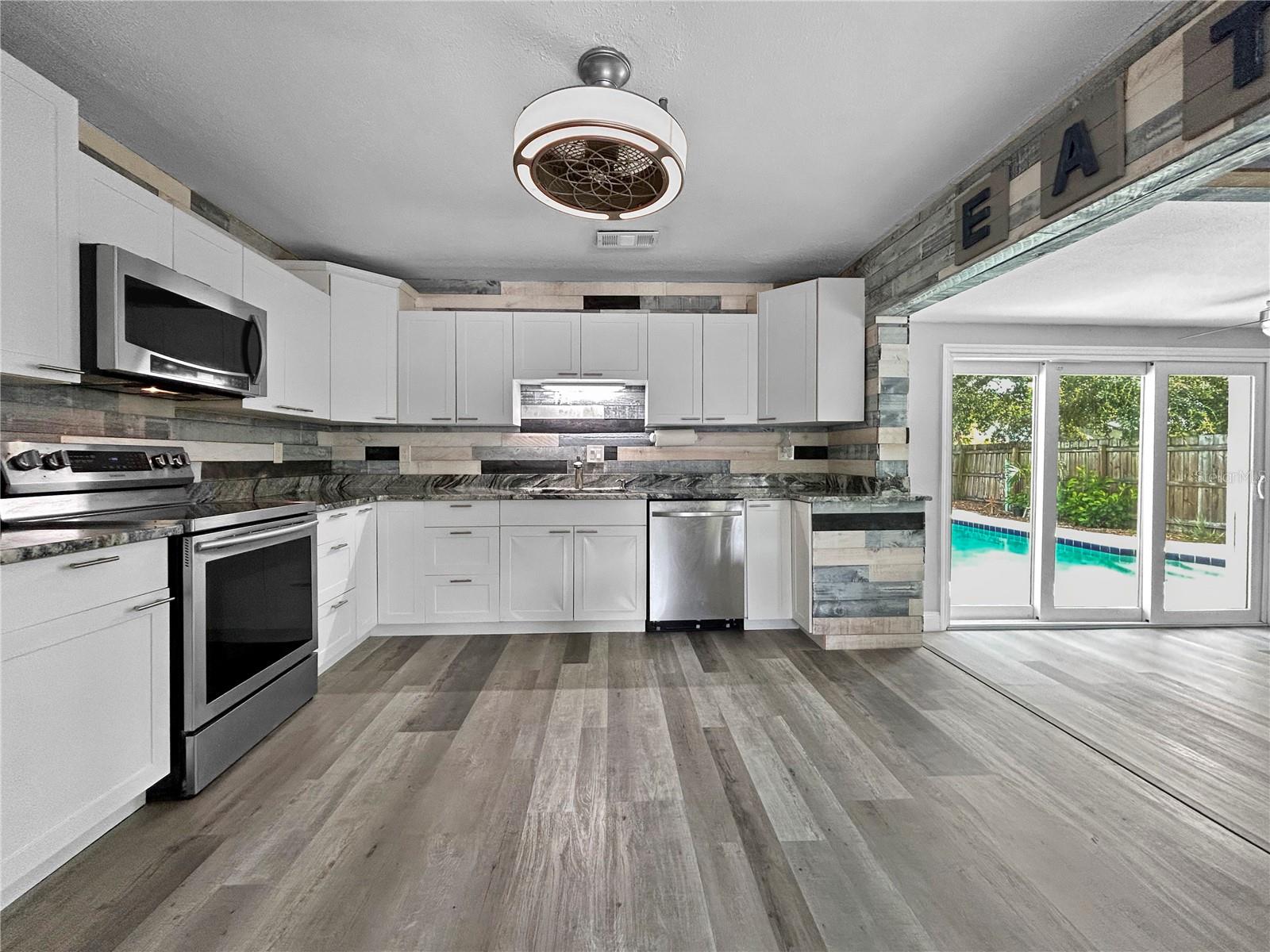 Large Kitchen with view of the pool area.