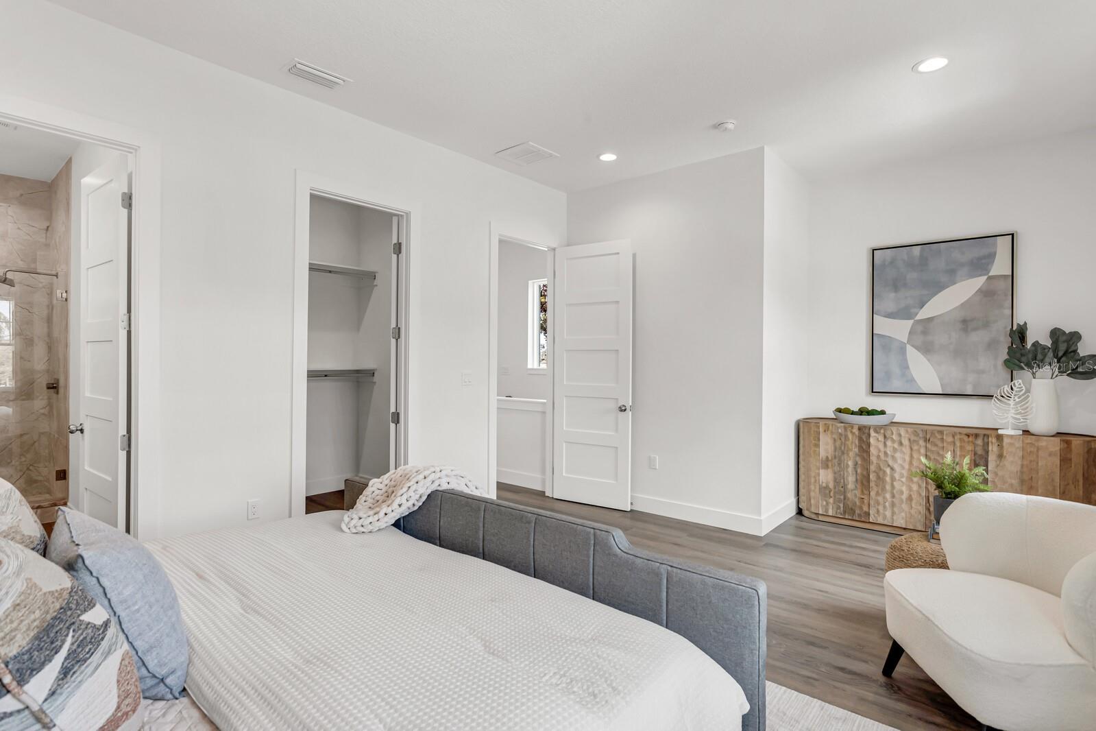 Primary bedroom...Another unit in the community that has been staged with furniture