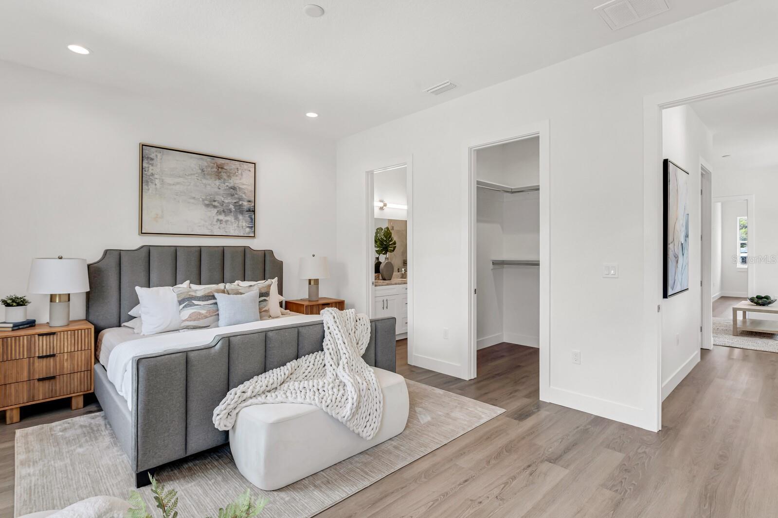 Primary bedroom...Another unit in the community that has been staged with furniture
