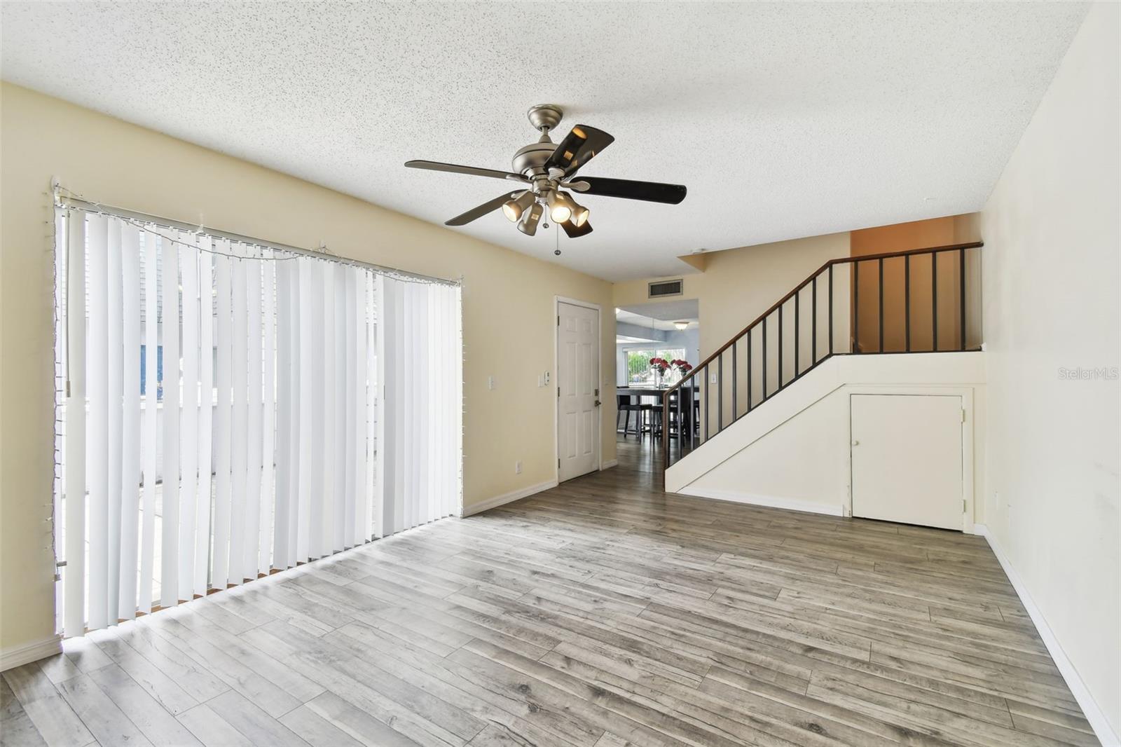 Living room. Note the small door under the stairs that provides extra storage.