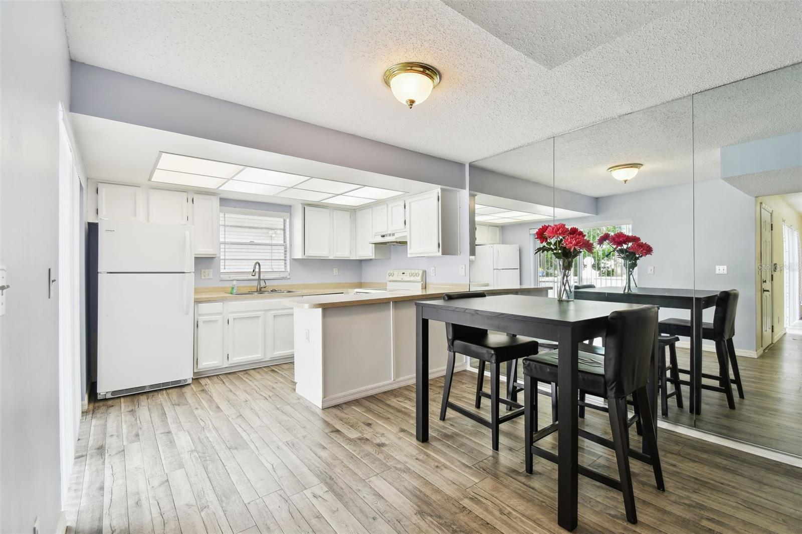 Dining area with floor to ceiling mirrors