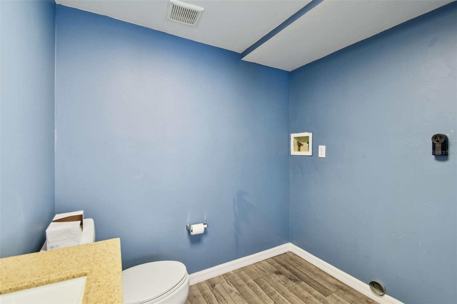 Washer/dryer hook up in half bath.