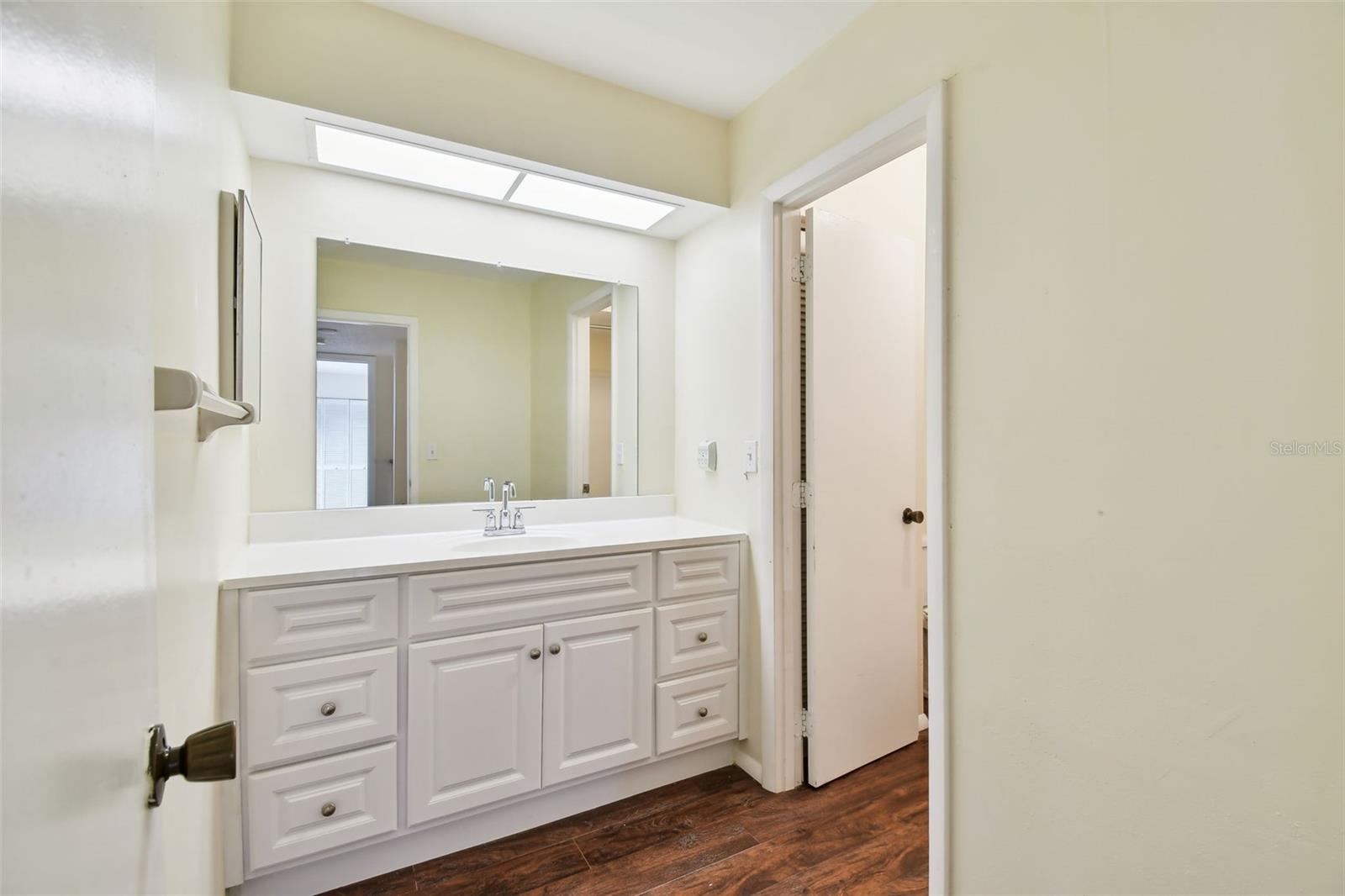 Full bath on 2nd floor. Note that sink and mirrored area is separate from the tub and toilet