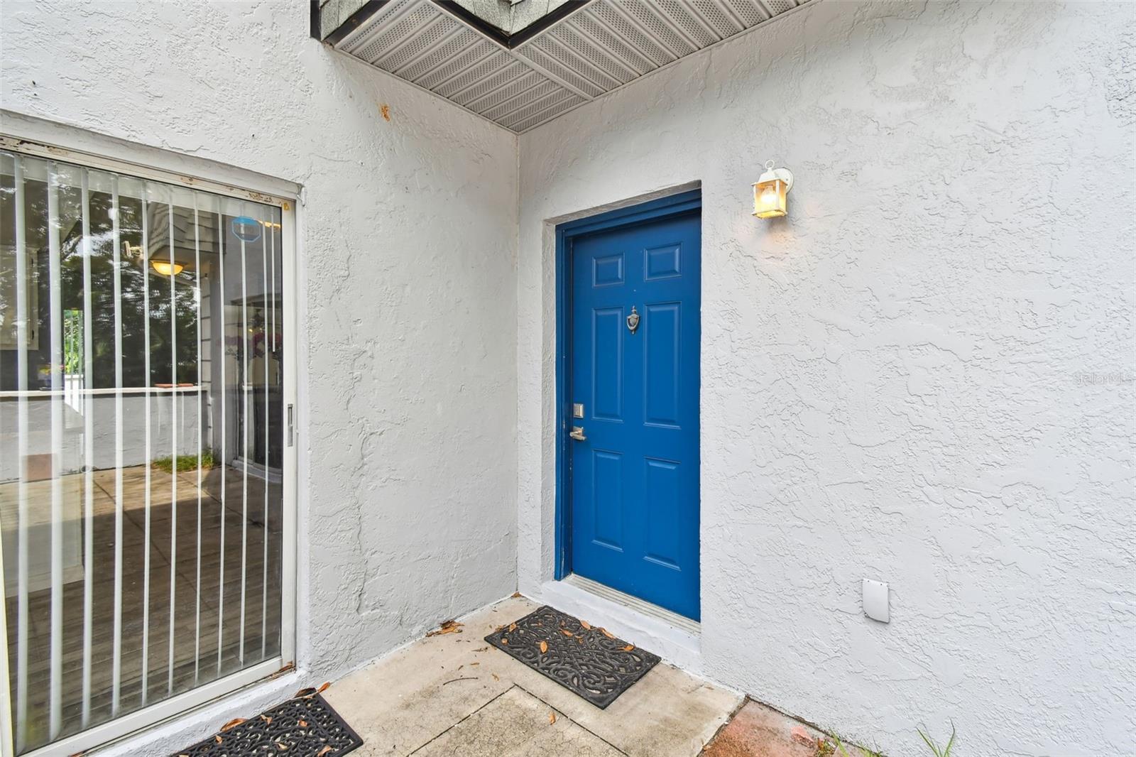 front door with sliding door to the kitchen