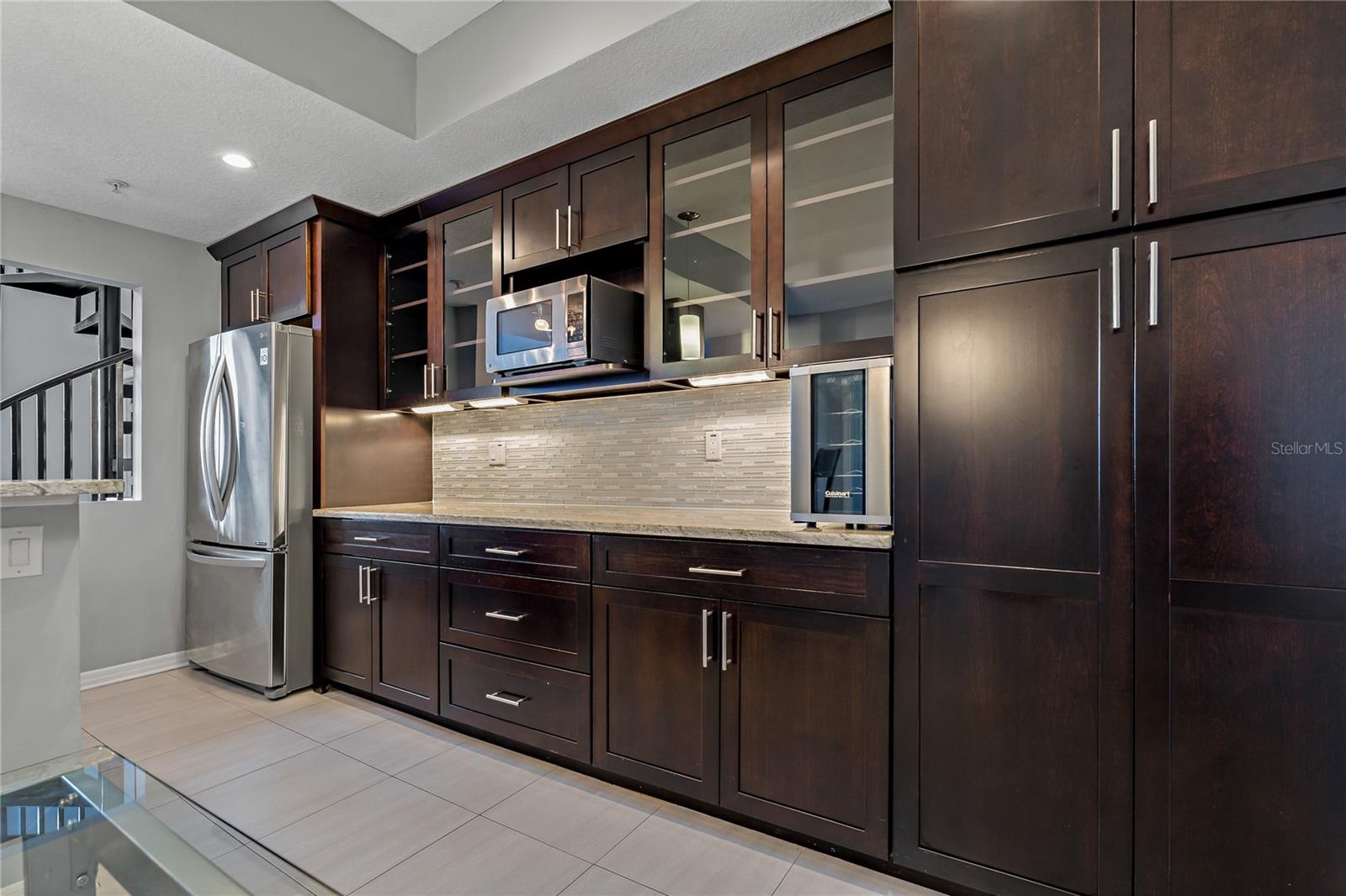 Extended Kitchen prep area with built-In Custom Cabinets and Hidden Pantry