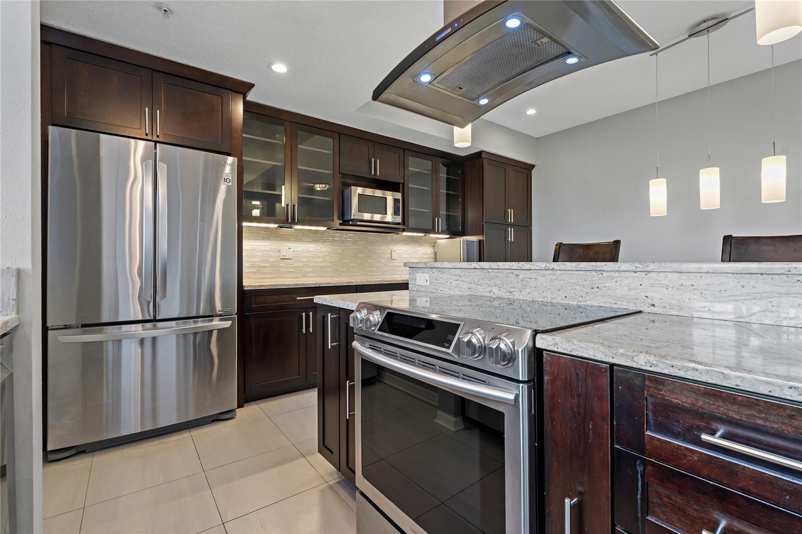Convection Oven and Vent Hood. Custom pull out drawers