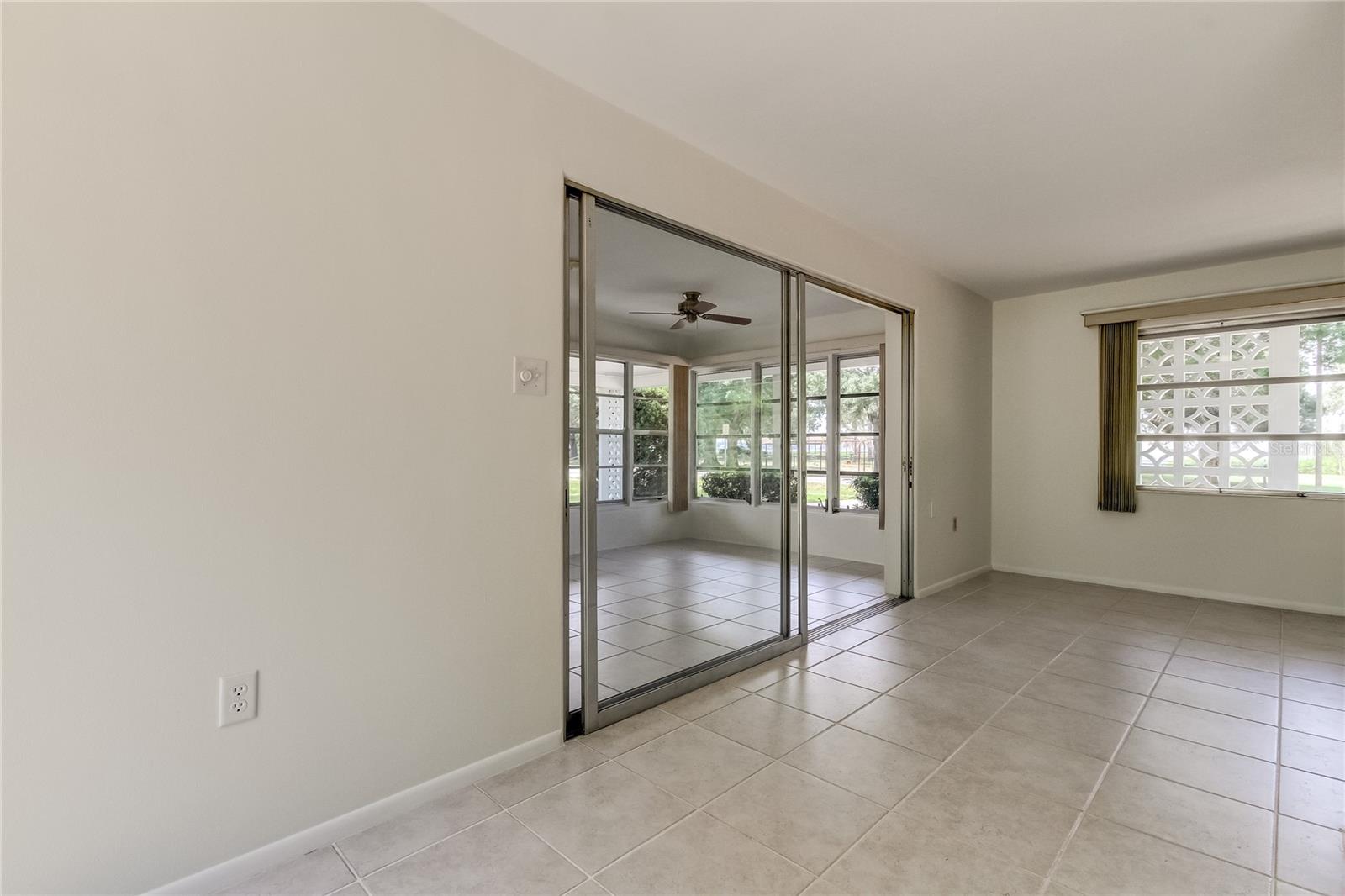 from dining room into sun room / bonus room