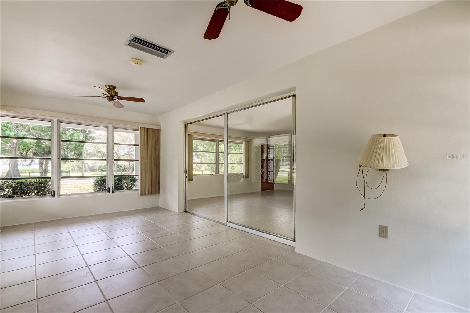 View from sun room / bonus room, looking to the waterfront views at the front of the home
