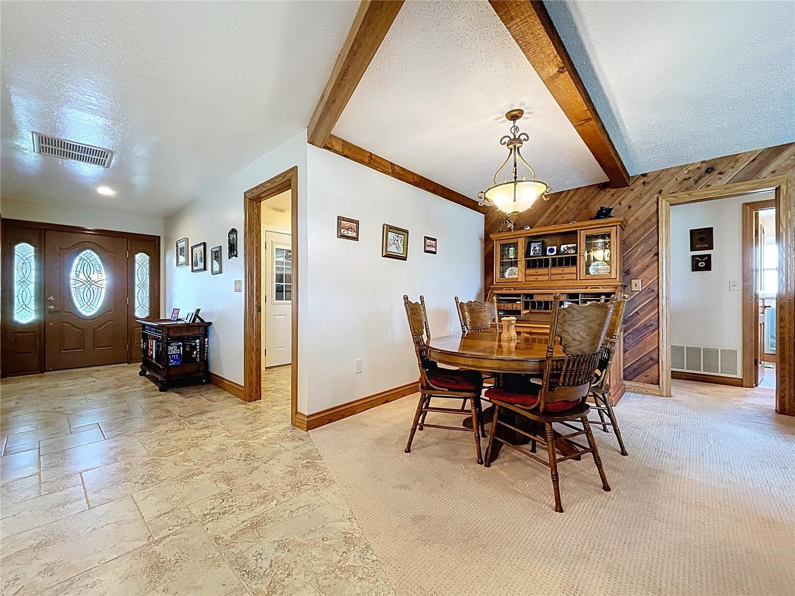The dining room sits just off of the kitchen and the Family room.