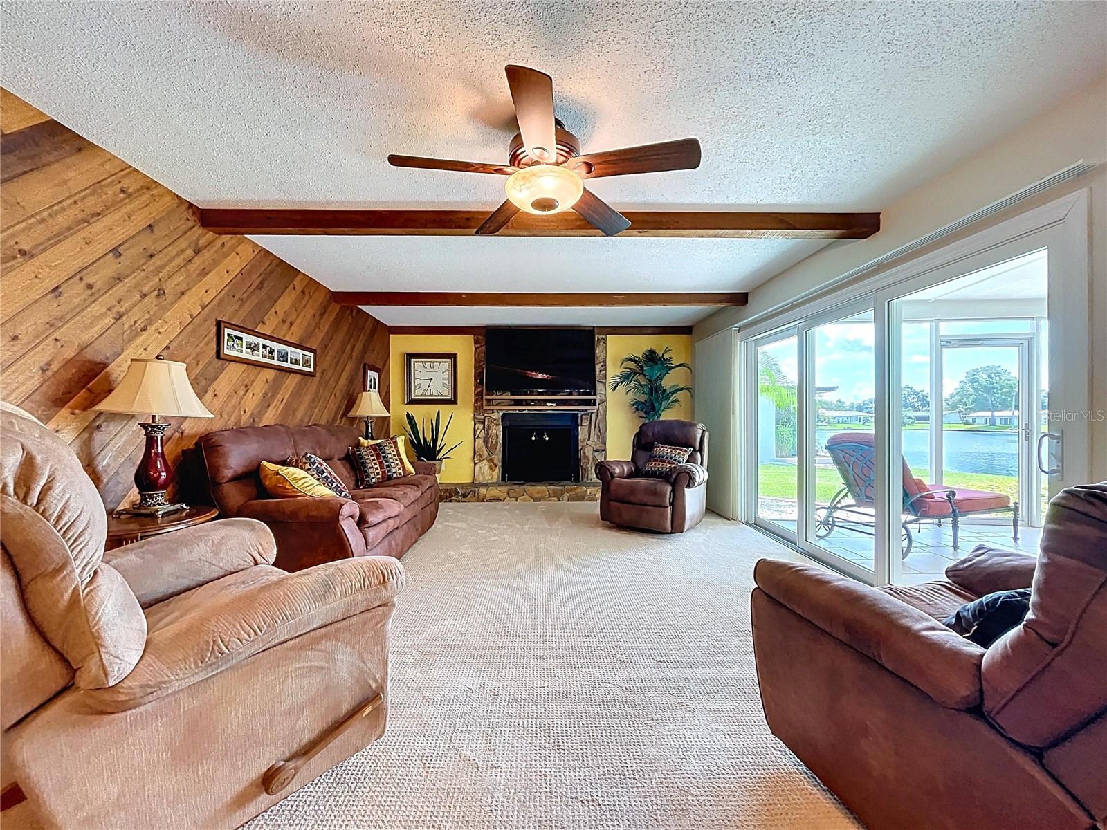 The Family room offers ample space to relaxation around the fireplace.