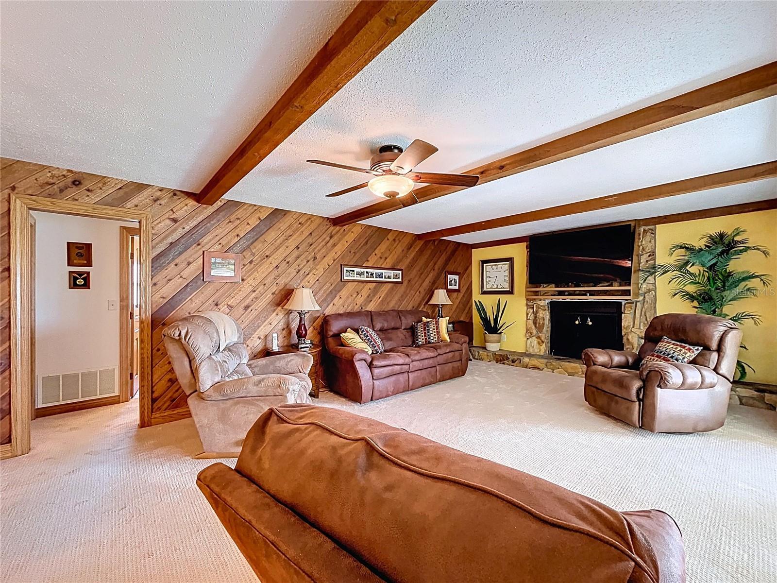 The Family room offers ample space to relaxation around the fireplace.