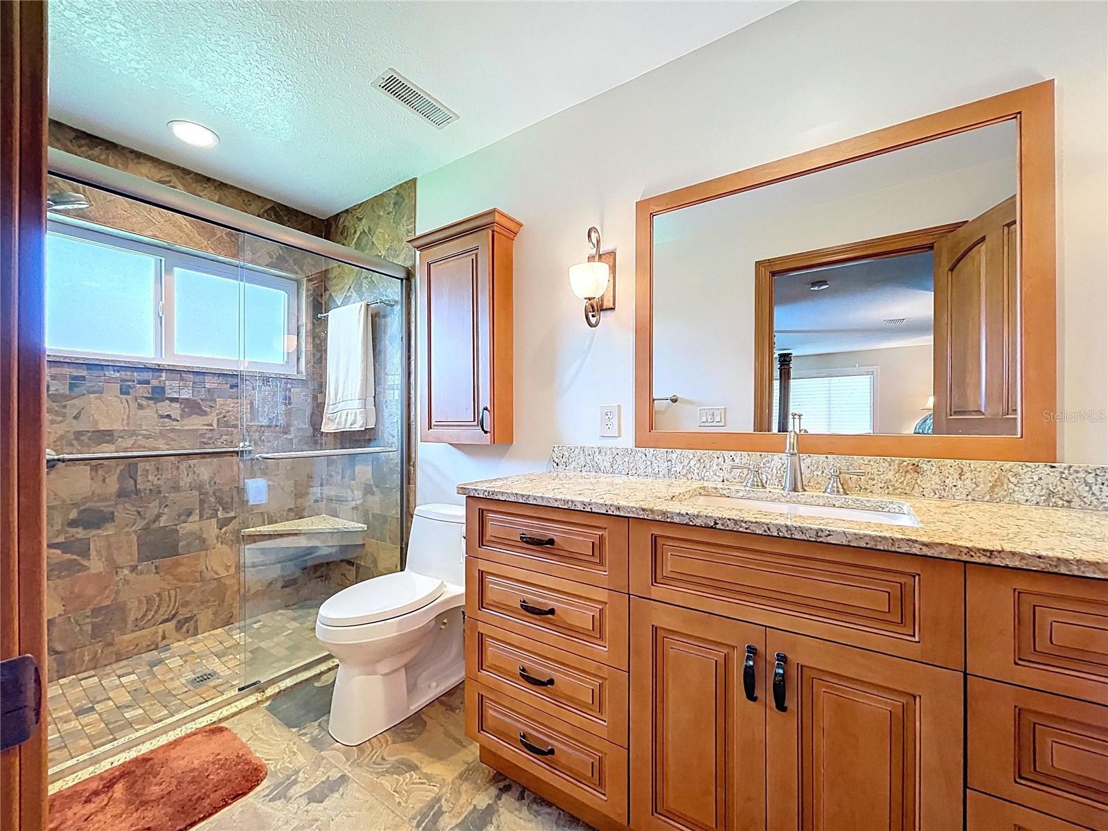 The en-suite bathroom is updated with a walk-in shower.