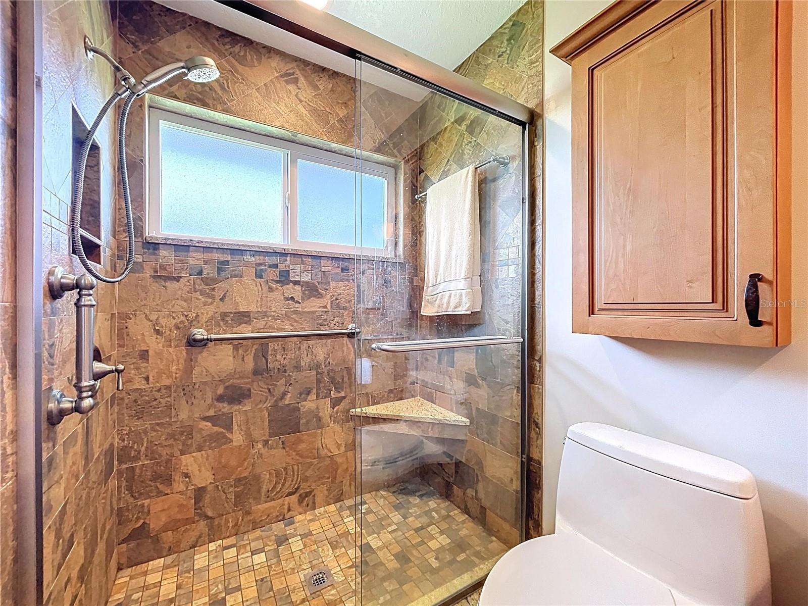 The en-suite bathroom is updated with a walk-in shower.