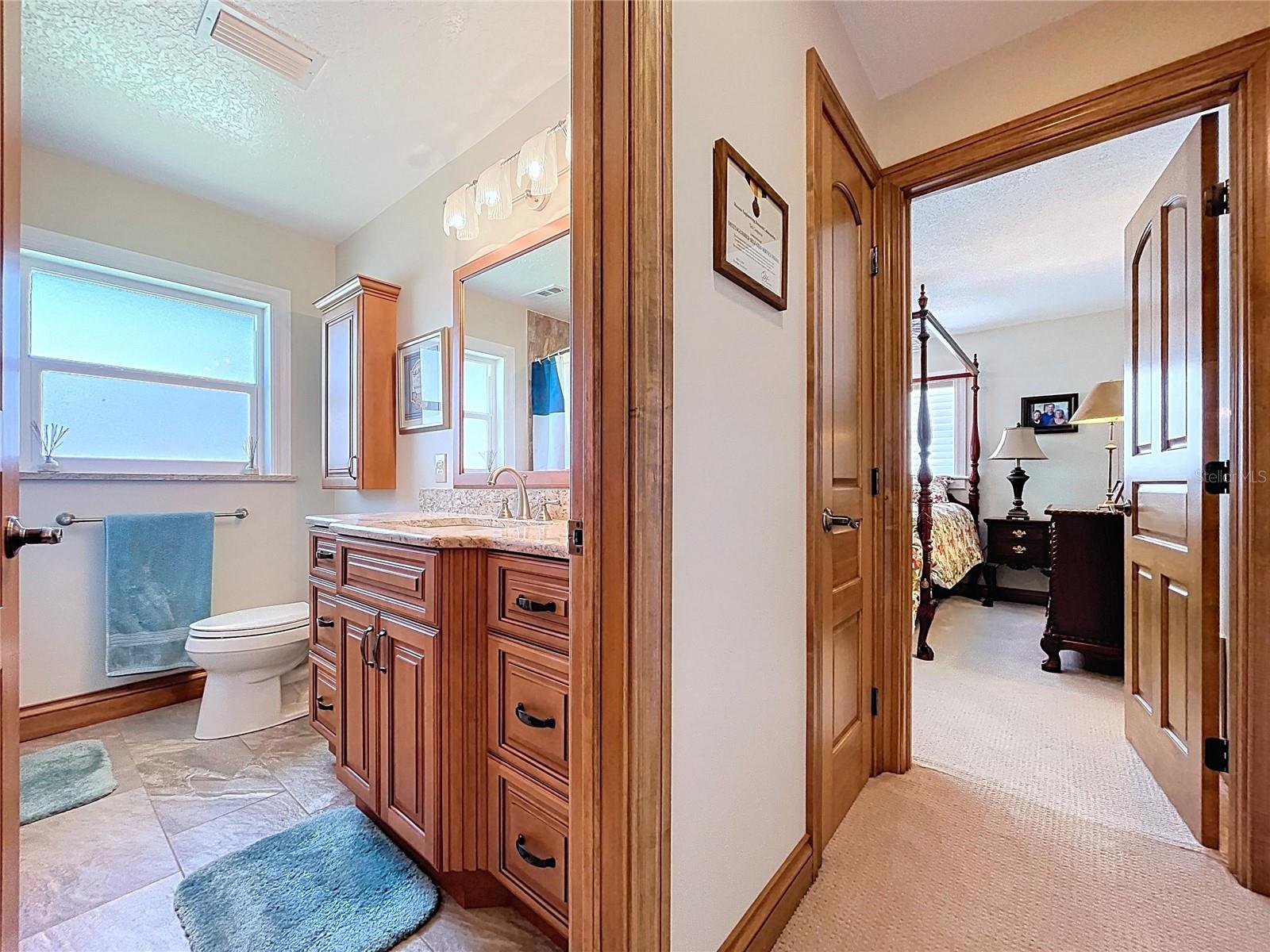 The updated guest bathroom is spotless and offers a shower with tub,