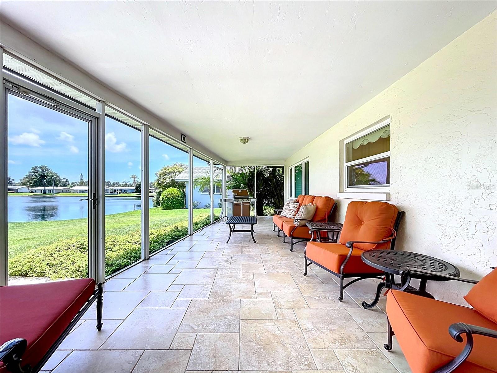 The screened in patio overs over 30' of outdoor space and views scenic of the lake.