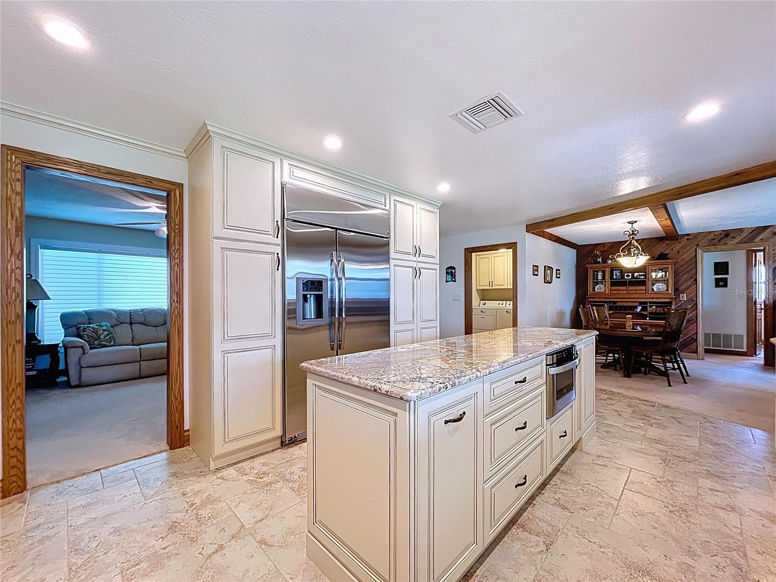 Oversized built-in refrigerator, large island for food prep and so much more!
