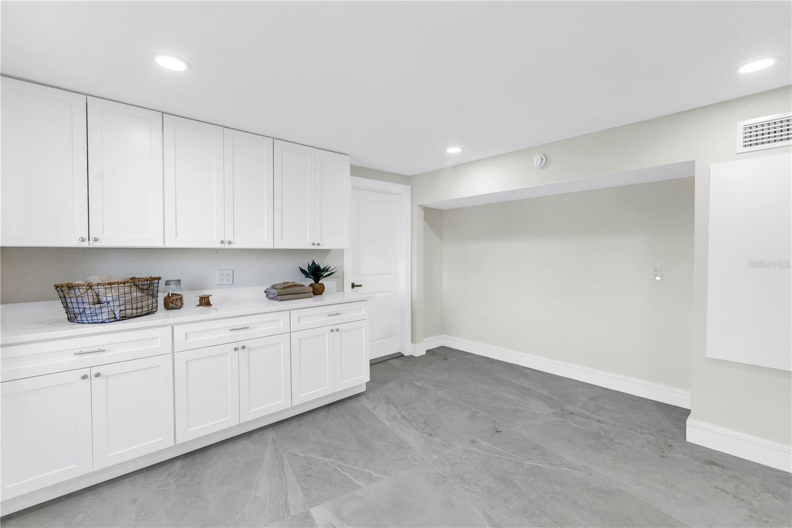 Laundry room is off the kitchen that leads to the garage.