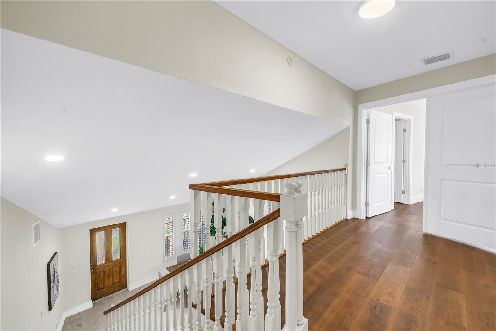Upper level landing offers space for a sitting area.