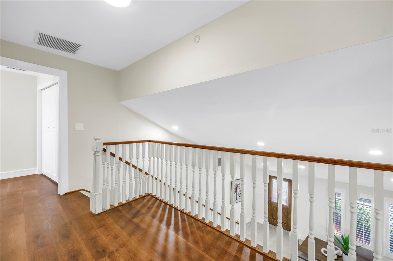 Upper level landing offers space for a sitting area.