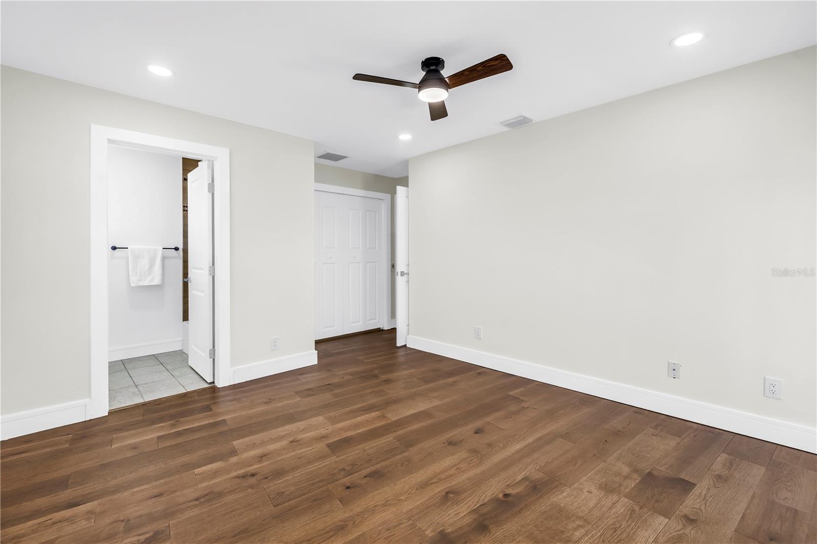 Upper guest bedroom #3 offers an en-suite and balcony access.