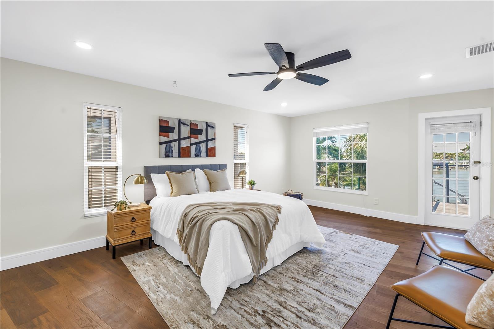 Generously sized owners suite showcases water views.